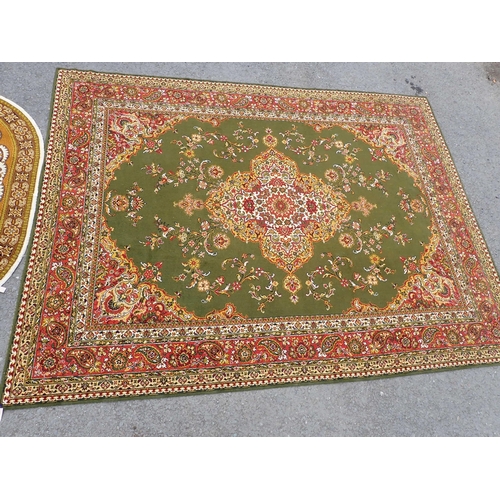 736 - A large machine made bordered Carpet with floral designs on a green ground, 11ft 10in x 9ft and a sm... 