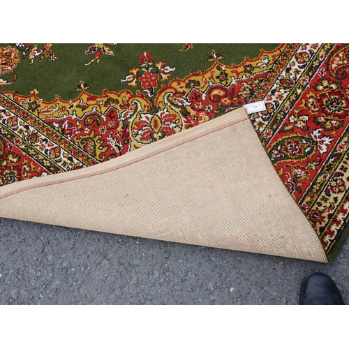 736 - A large machine made bordered Carpet with floral designs on a green ground, 11ft 10in x 9ft and a sm... 