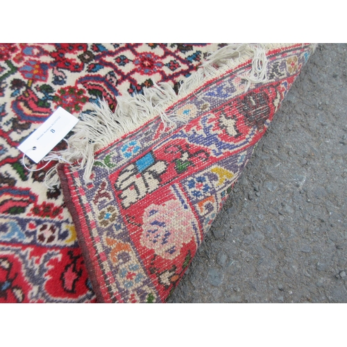 8 - A small bordered Persian Runner with herati pattern in mainly red on a cream ground