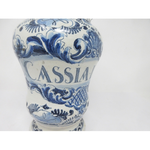 89 - An 18th Century Delft, blue and white Drug Jar titled 'CASSIA LIGNEA', stylised floral scroll surrou... 