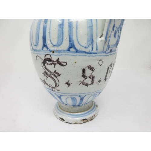 90 - A Delft blue and white Drug Jar with spout, manganese title 'S.S. Citri', 8in, A/F