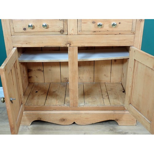 694 - A pine Cupboard fitted two frieze drawers above two cupboard doors 3ft W x 2ft 10in H and two Wall M... 