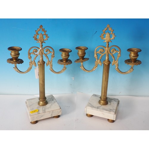 730 - A pair of gilt metal two branch Candle Stands with white marble bases, 12in H