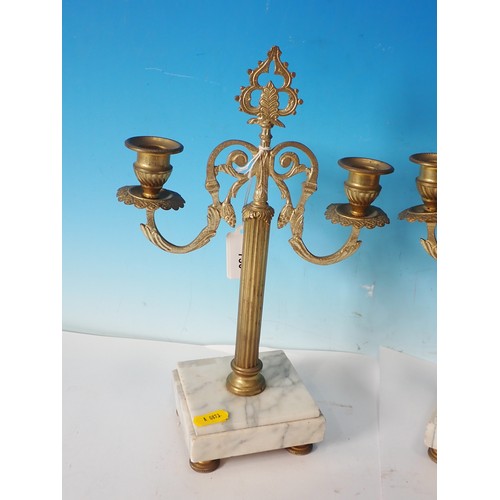 730 - A pair of gilt metal two branch Candle Stands with white marble bases, 12in H