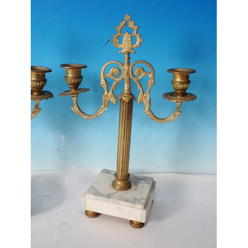 730 - A pair of gilt metal two branch Candle Stands with white marble bases, 12in H