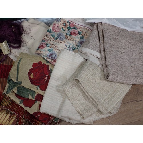 735 - A box of Table Cloths, Curtain Ties and Fabric