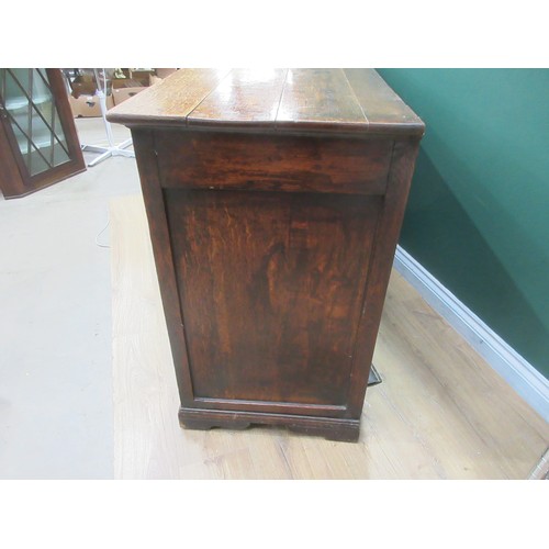 643 - An 18th Century oak and mahogany crossbanded enclosed Dresser Base fitted three frieze drawers above... 