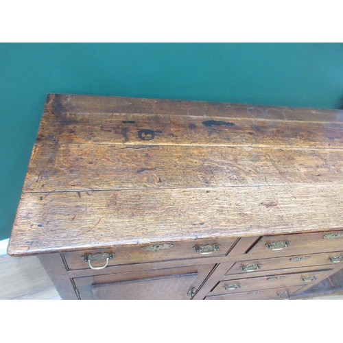 643 - An 18th Century oak and mahogany crossbanded enclosed Dresser Base fitted three frieze drawers above... 