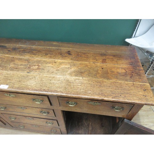 643 - An 18th Century oak and mahogany crossbanded enclosed Dresser Base fitted three frieze drawers above... 