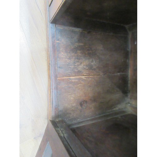 643 - An 18th Century oak and mahogany crossbanded enclosed Dresser Base fitted three frieze drawers above... 