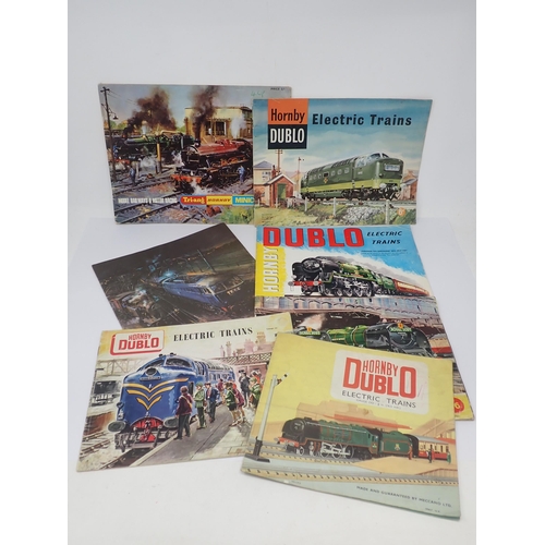 1048 - Twelve 2 and 3-rail Catalogues including Hornby-Dublo and Tri-ang/Hornby amalgamation catalogues tog... 