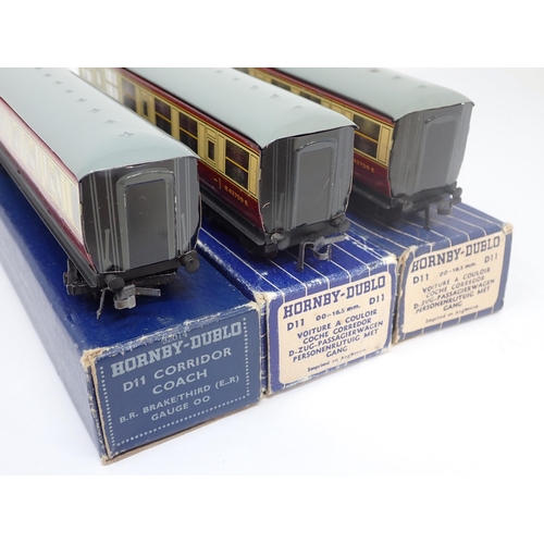 1050 - Three boxed Hornby-Dublo D11 Corridor Coaches. Coaches comprise 2x 1/3rd and 1x Brake/3rd. All excel... 