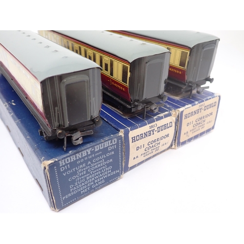 1050 - Three boxed Hornby-Dublo D11 Corridor Coaches. Coaches comprise 2x 1/3rd and 1x Brake/3rd. All excel... 