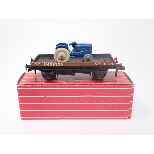 1054 - A rare boxed Hornby-Dublo No.4649 Low-sided Wagon with Tractor. Wagon has the tractor with beige dri... 