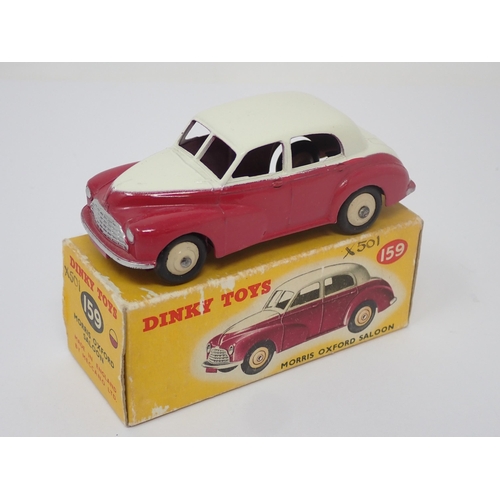 1155 - A boxed Dinky Toys No.159 maroon and cream Morris Oxford Saloon