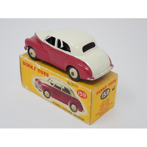 1155 - A boxed Dinky Toys No.159 maroon and cream Morris Oxford Saloon