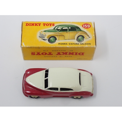 1155 - A boxed Dinky Toys No.159 maroon and cream Morris Oxford Saloon