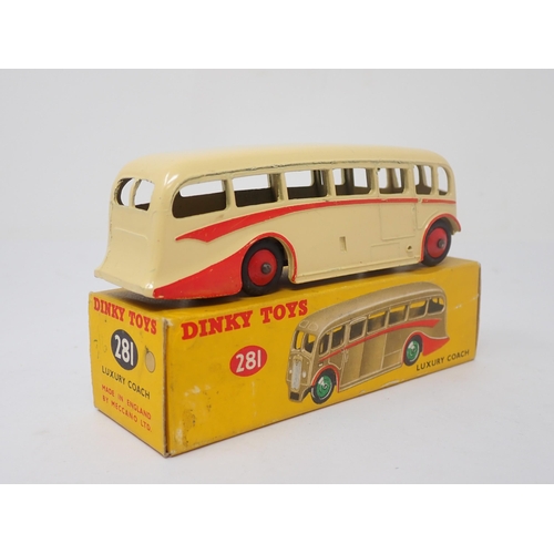 1161 - A boxed Dinky Toys No.281 Luxury Coach in cream livery with red flash