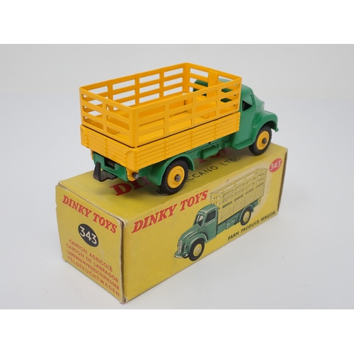 1167 - A boxed Dinky Toys No.343 yellow and green Farm Produce Wagon with plastic hubs