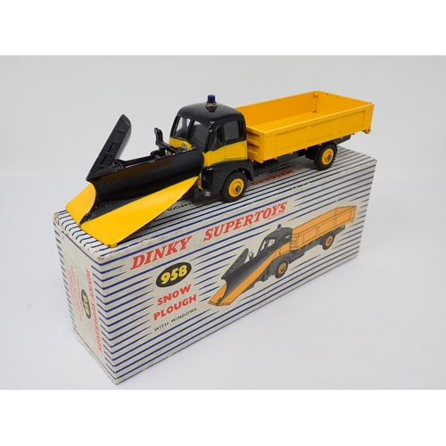 1171 - A boxed Dinky Toys No.958 yellow and black Snow Plough with packing