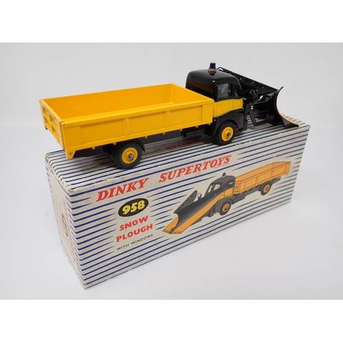 1171 - A boxed Dinky Toys No.958 yellow and black Snow Plough with packing