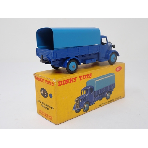 1173 - A boxed Dinky Toys No.413 blue Austin Covered Wagon