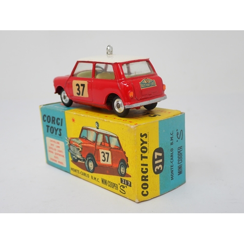 1185 - A boxed Corgi Toys No.317 Monte-Carlo B.M.C. Mini-Cooper S