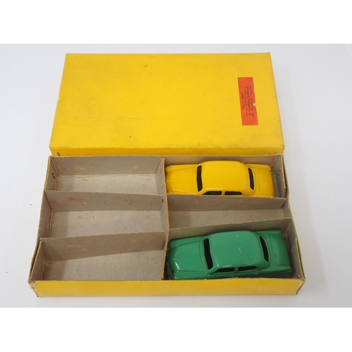 1193 - A Dinky Toys No.139A Trade Box containing two Ford 'Fordor' Sedans with dividers and Hudson Dobson l... 