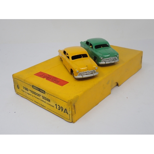 1193 - A Dinky Toys No.139A Trade Box containing two Ford 'Fordor' Sedans with dividers and Hudson Dobson l... 