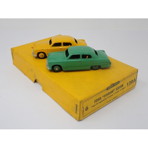 1193 - A Dinky Toys No.139A Trade Box containing two Ford 'Fordor' Sedans with dividers and Hudson Dobson l... 