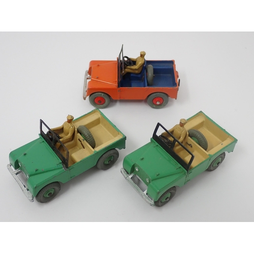 1194 - A Dinky Toys No.27D Trade Box containing three Land Rovers