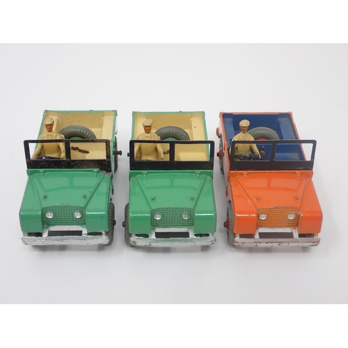 1194 - A Dinky Toys No.27D Trade Box containing three Land Rovers