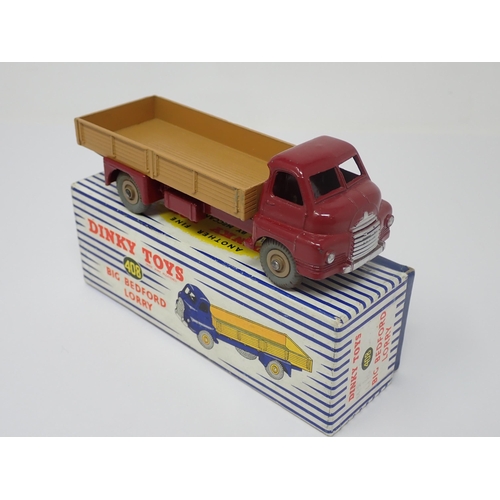 1195 - A boxed Dinky Toys No.408 maroon and tan Big Bedford Lorry