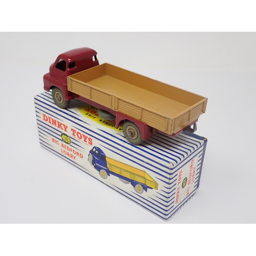 1195 - A boxed Dinky Toys No.408 maroon and tan Big Bedford Lorry