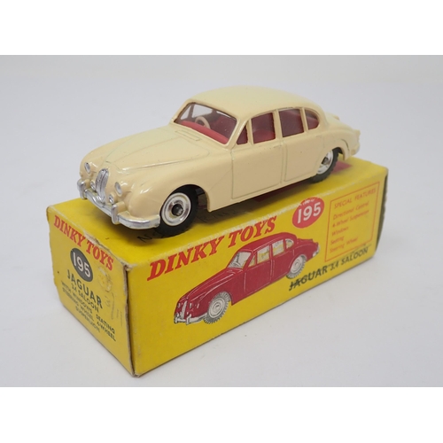 1204 - A boxed Dinky Toys No.195 cream Jaguar 3.4L Saloon