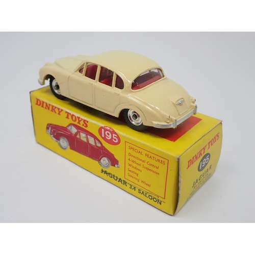 1204 - A boxed Dinky Toys No.195 cream Jaguar 3.4L Saloon