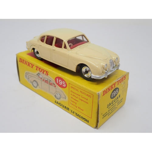 1204 - A boxed Dinky Toys No.195 cream Jaguar 3.4L Saloon