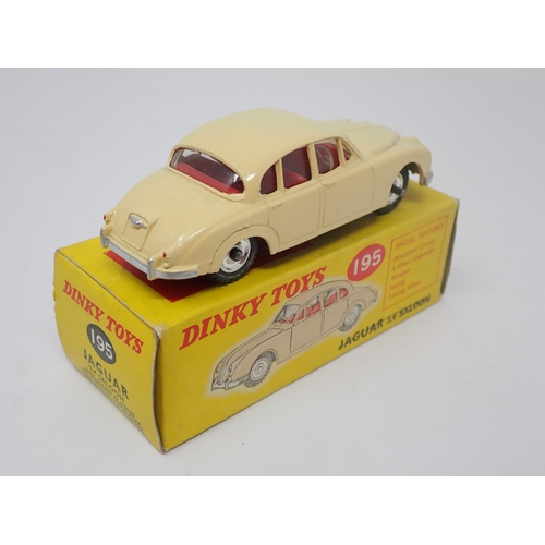 1204 - A boxed Dinky Toys No.195 cream Jaguar 3.4L Saloon