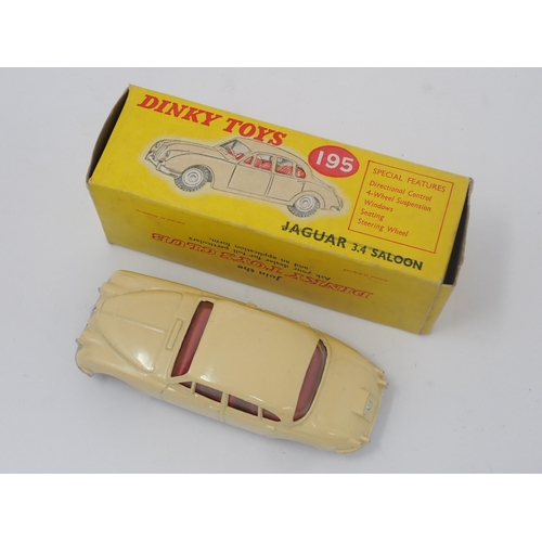 1204 - A boxed Dinky Toys No.195 cream Jaguar 3.4L Saloon