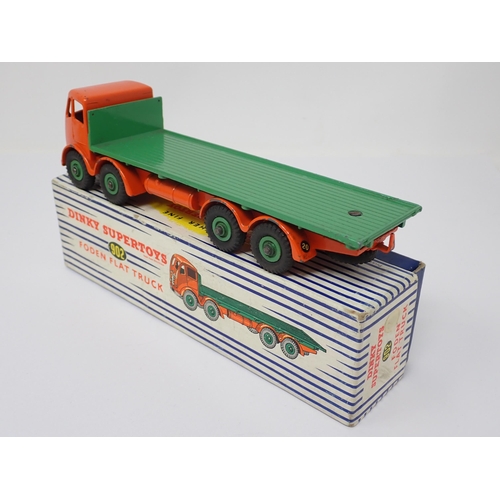 1224 - A boxed Dinky Toys No.902 orange and green Foden Flat Truck