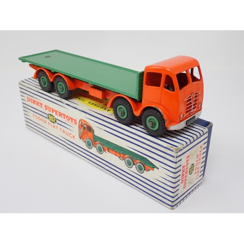 1224 - A boxed Dinky Toys No.902 orange and green Foden Flat Truck