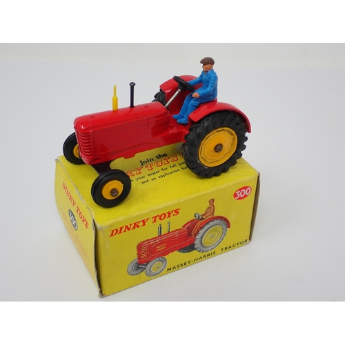 1231 - A boxed Dinky Toys No.300 Massey-Harris Tractor with yellow hubs