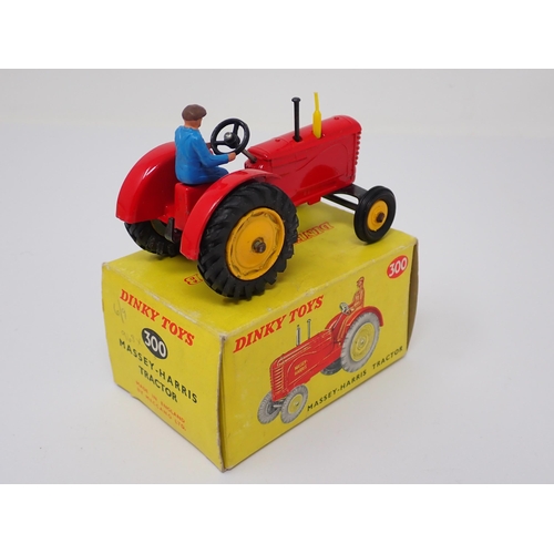 1231 - A boxed Dinky Toys No.300 Massey-Harris Tractor with yellow hubs