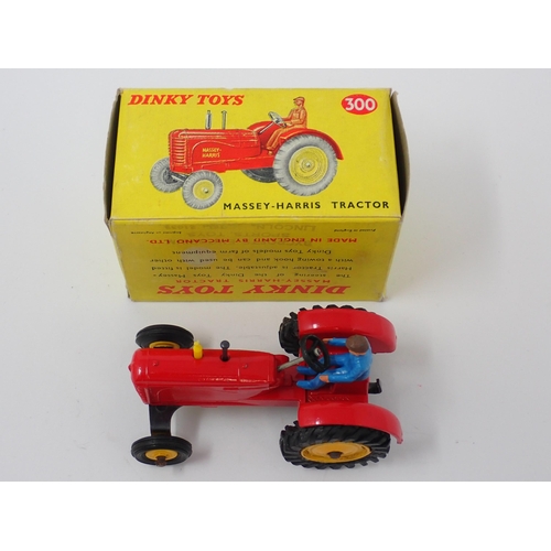 1231 - A boxed Dinky Toys No.300 Massey-Harris Tractor with yellow hubs