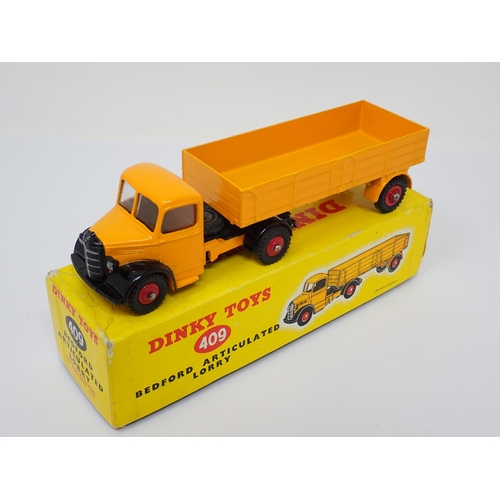 1234 - A boxed Dinky Toys No.409 yellow Bedford Articulated Lorry with red wheels