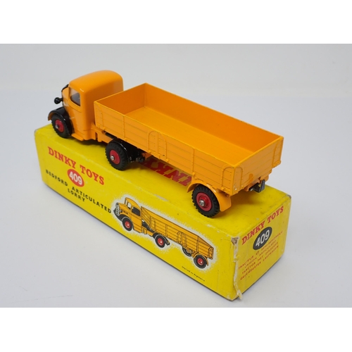 1234 - A boxed Dinky Toys No.409 yellow Bedford Articulated Lorry with red wheels