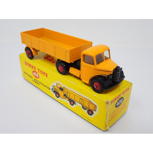 1234 - A boxed Dinky Toys No.409 yellow Bedford Articulated Lorry with red wheels