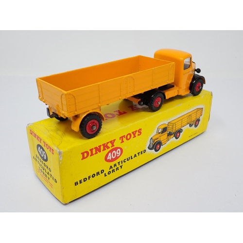 1234 - A boxed Dinky Toys No.409 yellow Bedford Articulated Lorry with red wheels