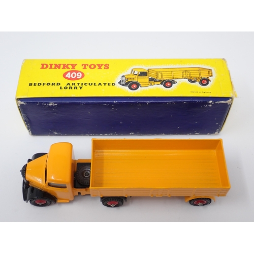 1234 - A boxed Dinky Toys No.409 yellow Bedford Articulated Lorry with red wheels