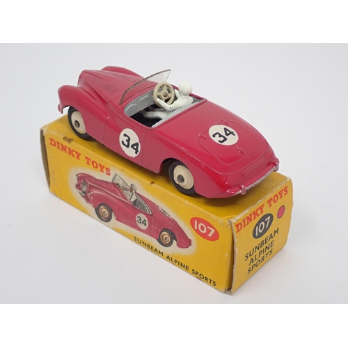 1235 - A boxed Dinky Toys No.107 maroon Sunbeam Alpine Sports